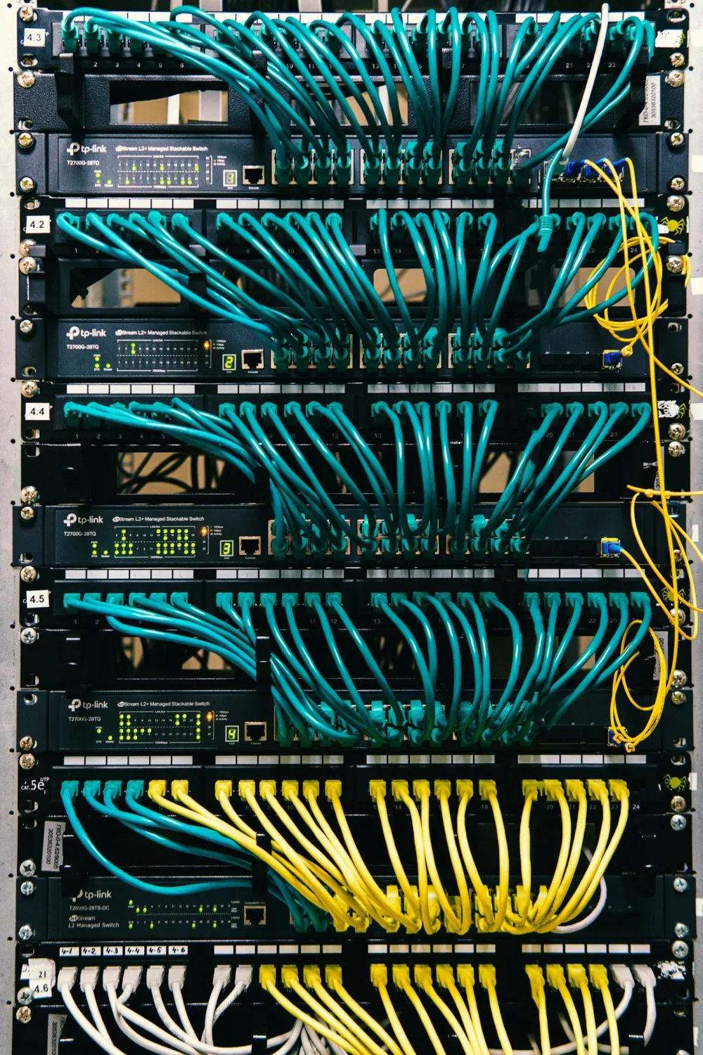 Managed network switches connected through structured Ethernet cabling