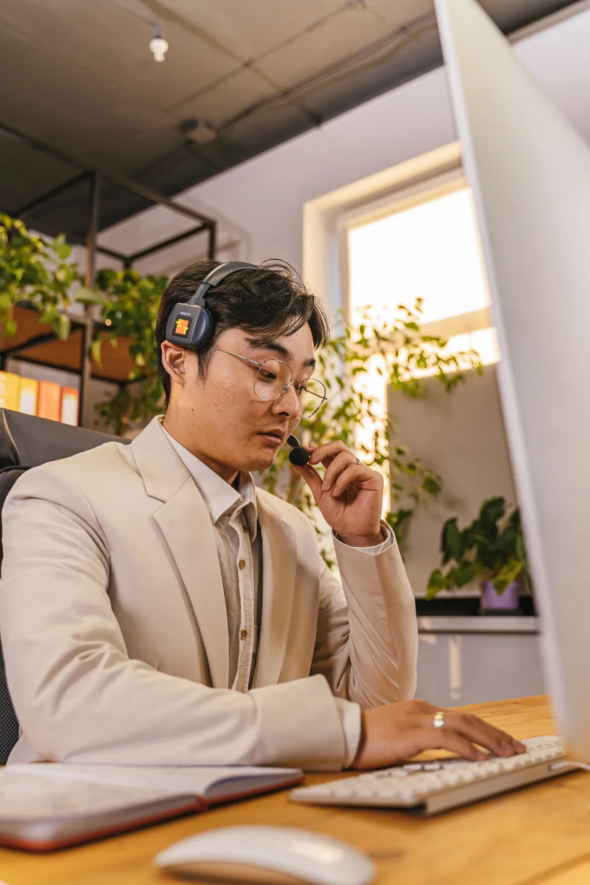 Business professional speaking with a customer through a computer headset